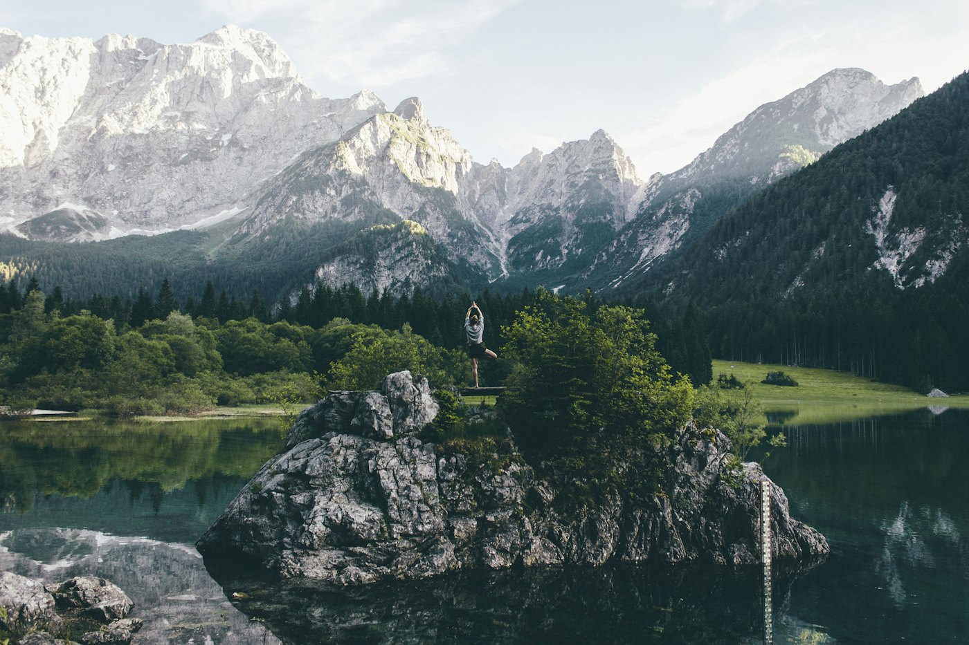 Jagged Dolomite peaks above a green alpine lake