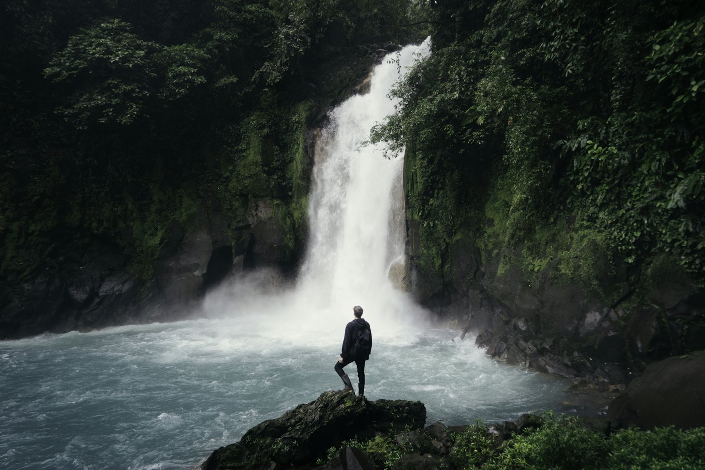 A waterfall in a green ravine